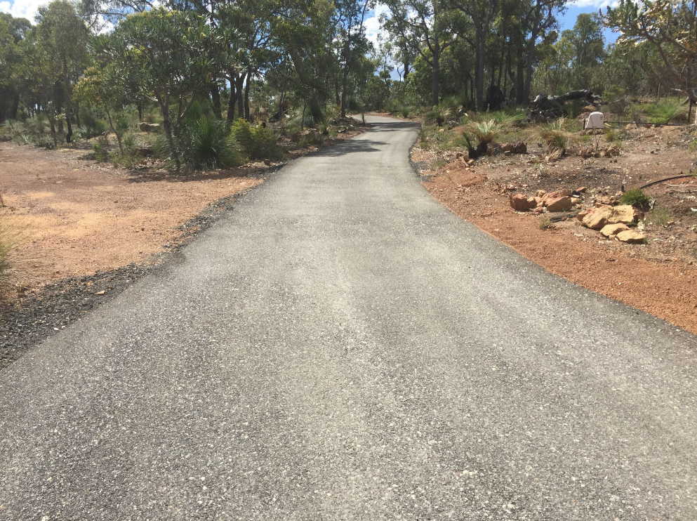 This is a photo of a hot spray & seal bitumen driveway which is in the process of being installed by Geelong Road Tech